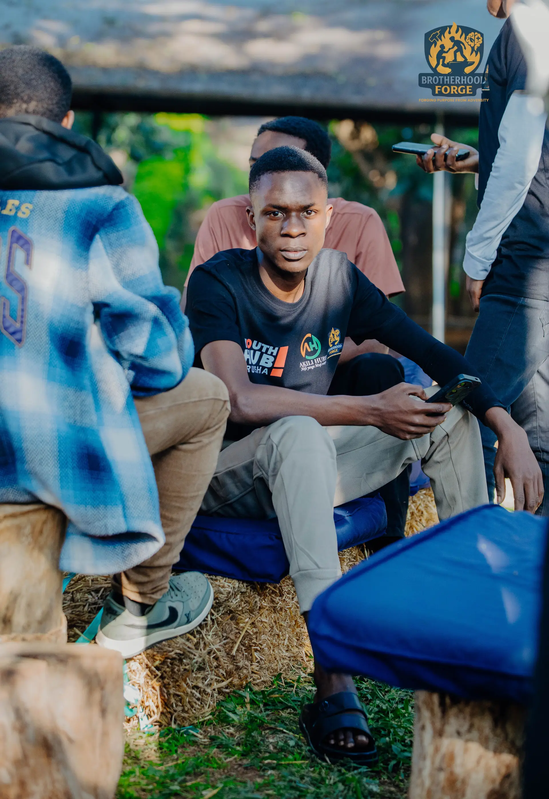 Brotherhood Forge community members in a warm peer-to-peer conversation