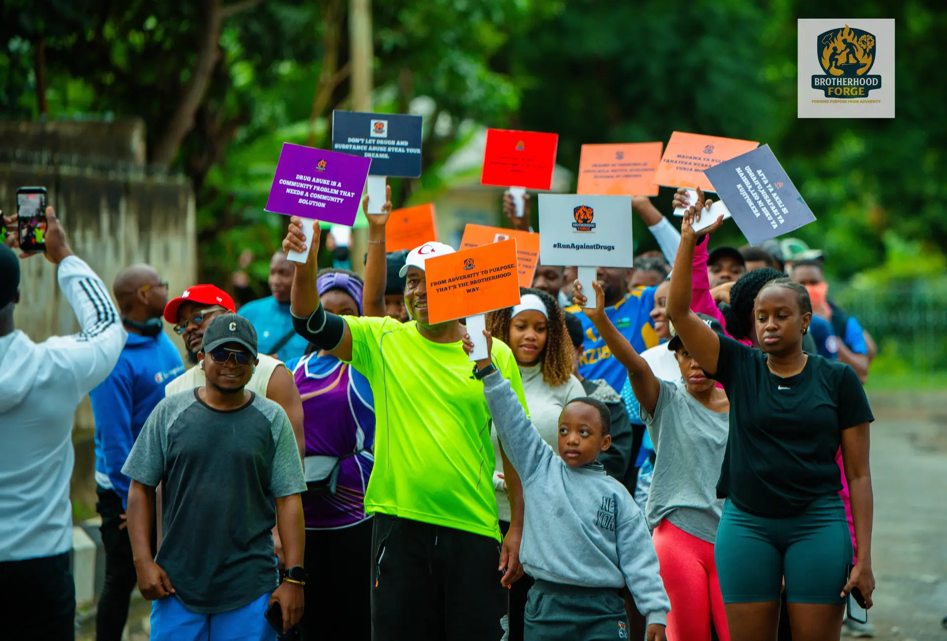 Brotherhood Forge participants carrying awareness messages during the event
